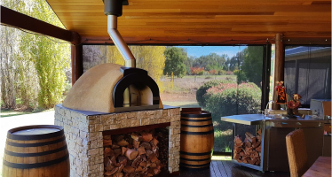 What is the best location for a wood fired oven?